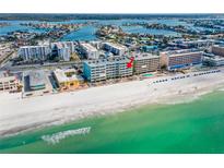 Beautiful aerial view of the beachfront condo, with white sand beach and emerald gulf waters at 17200 Gulf Blvd # 302, North Redington Beach, FL 33708