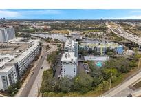 Stunning aerial view showcasing the One Laurel Place condo building and surrounding downtown cityscape at 201 W Laurel St # 909, Tampa, FL 33602