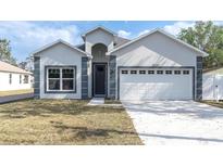 Charming single-Gathering home with an attached garage and freshly cut lawn at 5341 71St N Way, St Petersburg, FL 33709