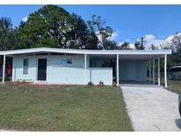 Charming single-story home with carport and freshly painted exterior at 7908 Rideout Rd, Tampa, FL 33619