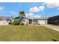 Charming single-story home with well-manicured lawn and attached one car garage at 3823 Sail Dr, New Port Richey, FL 34652