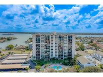 Luxury waterfront condo building with pool, parking, and beautiful water views at 400 Island Way # 305, Clearwater Beach, FL 33767