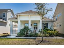 Charming single-story home with a welcoming front porch and beautiful landscaping at 811 Winterside Dr, Apollo Beach, FL 33572