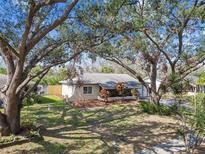 Charming single-story home featuring mature trees and a well-maintained front yard at 9920 62Nd N St, Pinellas Park, FL 33782