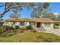 Charming single-story home featuring well-maintained landscaping and a welcoming front entrance at 4101 W Leila Ave, Tampa, FL 33616