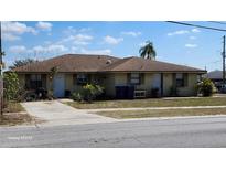 Cozy single-story home featuring a well-maintained lawn, inviting facade, and a concrete driveway at 5507 Riddle Rd, Holiday, FL 34690