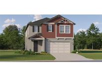 Two-story home with a two-car garage, well-manicured lawn and colorful, eye-catching, neutral paint scheme at 11542 E 71St Ter, Palmetto, FL 34221
