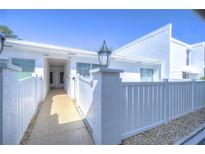 Inviting walkway to the front entrance, accentuated by a stylish lamp post and well-maintained exterior at 1655 S Highland Ave # B110, Clearwater, FL 33756