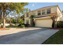 Charming two-story home with a two-car garage and a well-manicured lawn at 732 June Lake Ln, Brandon, FL 33510