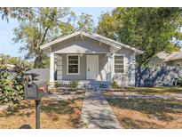 Charming single-story home featuring a cozy front porch and well-maintained yard at 1212 E New Orleans Ave, Tampa, FL 33603