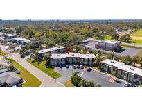 Scenic condo building offering convenient parking and well-maintained landscaping at 1370 70Th N St # 2-1382, St Petersburg, FL 33710