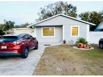 Charming single-story home features a well-maintained lawn and neutral exterior paint at 8503 N Willow Ave, Tampa, FL 33604