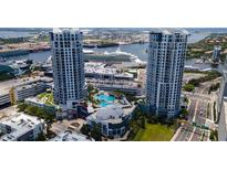 Stunning aerial view of the Towers condo complex featuring a pool, cruise ship and waterfront access at 449 S 12Th St # 1105, Tampa, FL 33602