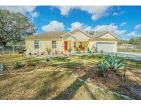 Charming single-story home with a well-manicured front yard and a welcoming entrance at 7301 Avocet Dr, Wesley Chapel, FL 33544