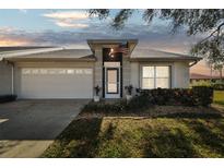Charming single-story home with a well-maintained front yard and attached two-car garage at 2509 Estancia Blvd, Clearwater, FL 33761