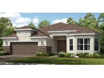 Charming single-story home with a two-car garage and manicured lawn and appealing stone accents at 29924 Rusco Ct, Wesley Chapel, FL 33545