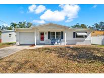 Charming single-story home with a white brick foundation and well-manicured front lawn at 1180 San Remo Dr, Largo, FL 33770