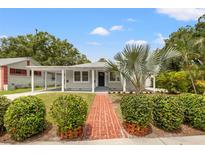 Charming single-story home featuring a brick walkway and a covered carport at 2835 Valencia S Way, St Petersburg, FL 33705