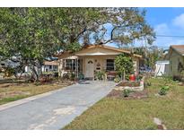 Charming single-story home with a well-manicured lawn and inviting front porch at 5559 17Th N Ave, St Petersburg, FL 33710