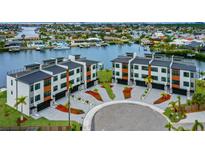 New luxury townhomes feature modern design, private garages and waterfront access at 774 Gran Kaymen Way, Apollo Beach, FL 33572