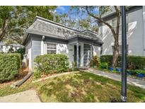 Charming single-story home with a well-maintained lawn and mature landscaping at 1287 N Mcmullen Booth Rd, Clearwater, FL 33759