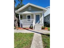 Charming single-story home features a welcoming front porch and manicured landscaping at 1321 W North B St, Tampa, FL 33606