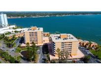 Aerial view of the waterfront condos showcasing beautiful landscaping and coastal views at 7432 Sunshine Skyway S Ln # 206, St Petersburg, FL 33711