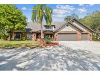 Lovely home featuring a spacious three-car garage and well-maintained landscaping at 1902 Sweet Bay Ct, Plant City, FL 33566