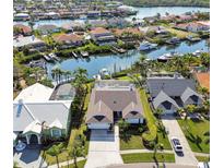 Waterfront homes featuring boat docks along a beautiful canal leading to the bay at 944 Symphony Isles Blvd, Apollo Beach, FL 33572