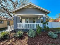 Charming home with a welcoming front porch and well-maintained landscaping at 2111 26Th S St, St Petersburg, FL 33712