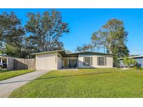 Charming single Gathering home with a well-maintained lawn and mature trees offering great curb appeal at 2905 Bay St, Sarasota, FL 34237