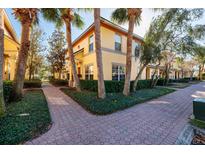 Charming two-story home with lush landscaping, sidewalks, and inviting curb appeal, perfect for relaxed community living at 122 Coquina Bay Dr, St Petersburg, FL 33705