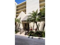 Attractive building entrance featuring nice landscaping and ample space to welcome residents and guests at 2700 Cove Cay Dr # 4-B, Clearwater, FL 33760