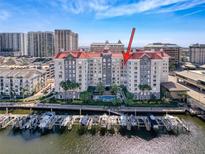 Harborview condo building with boat slips, waterfront pool, palm trees, and luxurious architecture at 700 S Harbour Island Blvd # 721, Tampa, FL 33602