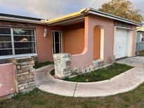 Charming single-story home with a stone accent facade and a cozy covered entryway at 8428 Paxton Dr, Port Richey, FL 34668