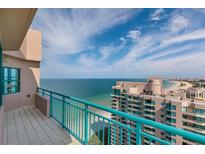 Balcony view overlooking beautiful turquoise waters and beach condos at 1540 Gulf Blvd # Ph7, Clearwater Beach, FL 33767