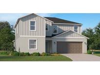 Beautiful two-story home with vertical siding, concrete foundation, and a two car garage at 10248 Purple Leaf Ct, Riverview, FL 33578