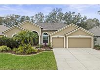 Charming one-story home featuring a well-manicured lawn, tasteful landscaping, and a convenient two-car garage at 108 Rosana Dr, Brandon, FL 33511