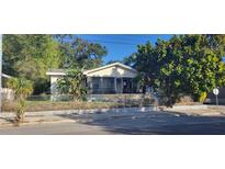 Charming single-story home featuring a screened porch and traditional architecture at 3201 N 15Th St, Tampa, FL 33605