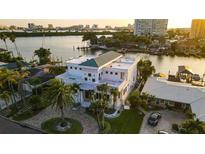 Luxury waterfront home aerial view, showcasing unique architecture & canal views at 42 Midway Is, Clearwater, FL 33767