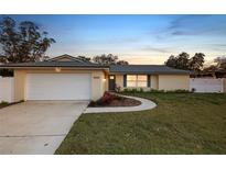 Updated single-story home with a large yard and attached garage at 13344 Sorrento Dr, Largo, FL 33774