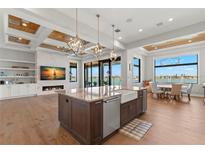 Gourmet kitchen with island, stainless steel appliances, and water views at 266 8Th N Ave, Tierra Verde, FL 33715