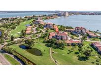 Aerial view of condo community near golf course and waterfront at 6219 Palma Del Mar S Blvd # 602, St Petersburg, FL 33715