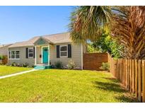 Charming bungalow with teal door and well-manicured lawn at 4320 3Rd N Ave, St Petersburg, FL 33713