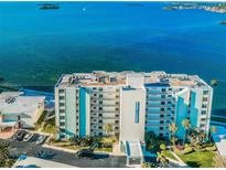 Aerial view of waterfront building, showcasing its location and size at 300 Woodette Dr # 202B, Dunedin, FL 34698