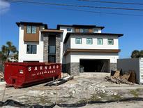 Modern two-story home with mixed material facade and an attached two-car garage at 2121 Bayou Grande Ne Blvd, St Petersburg, FL 33703