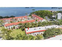 A beautiful view of a condo community with stunning waterfront views and lush landscaping at 2700 Bayshore Blvd # 559, Dunedin, FL 34698