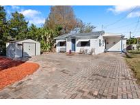 Charming bungalow with brick paver driveway, storage shed, and landscaped yard at 4631 42Nd N Ave, St Petersburg, FL 33714
