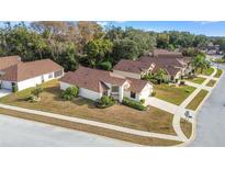 Single-Gathering home in a quiet residential neighborhood with mature trees at 9131 Haas Dr, Hudson, FL 34669