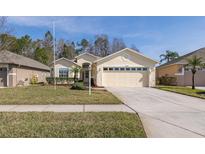 One-story house with a two-car garage and well-maintained lawn at 1153 Dustan Pl, Trinity, FL 34655